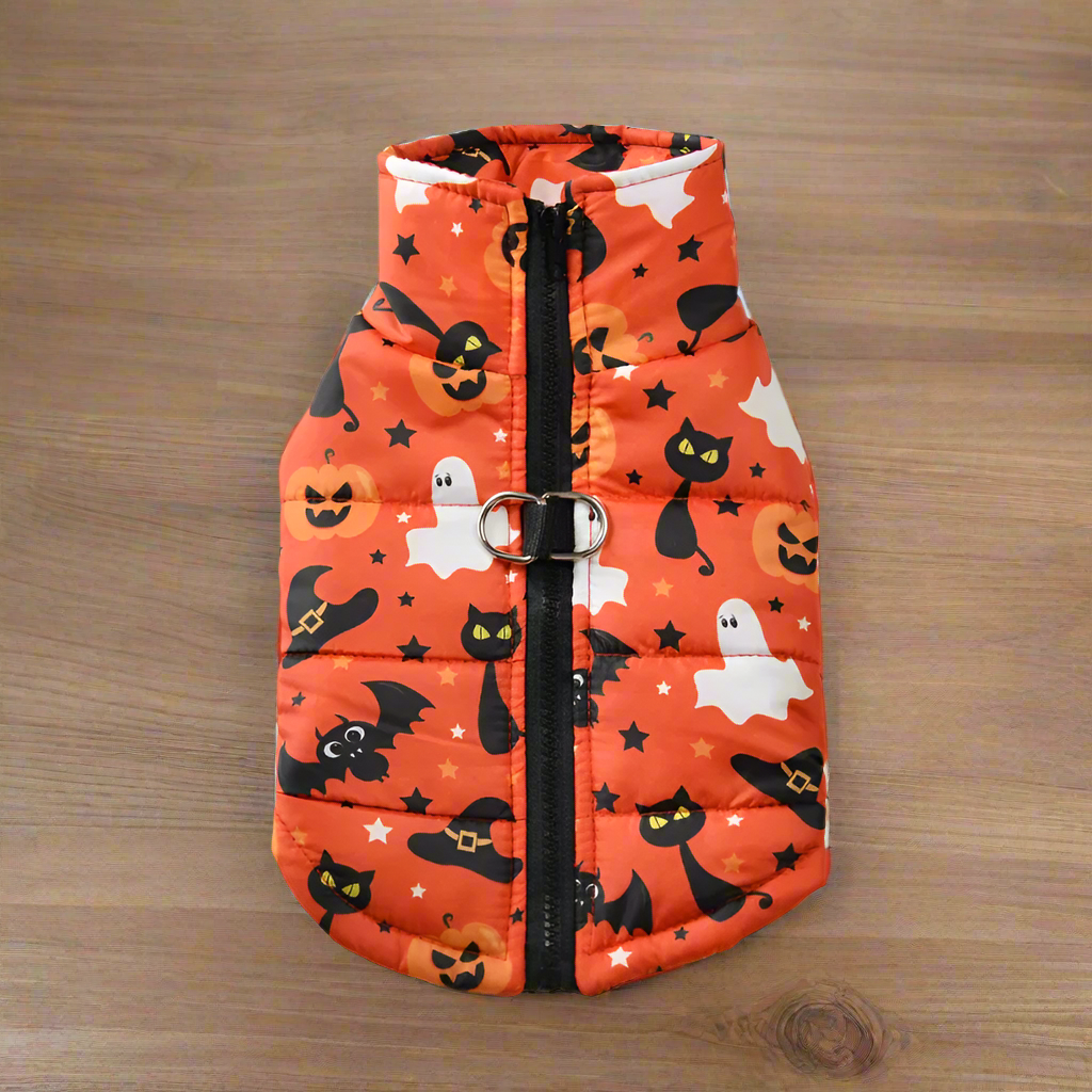 Halloween-themed pet coat with pumpkins, ghosts, and cats on an orange background.