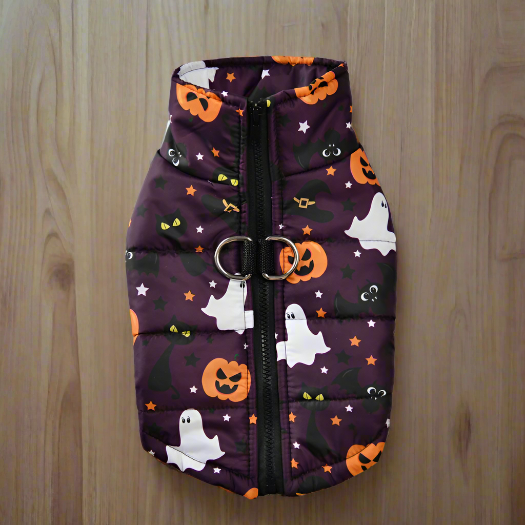 Halloween-themed pet vest with pumpkins, ghosts, and cats on a purple background