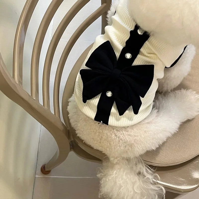 Dress your pup in luxury with the Elegant Bow Lace Dog Dress. Soft lace, a stunning bow, and a comfortable fit make this dress perfect for any stylish occasion. white dog model