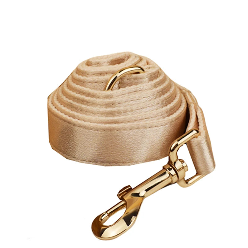 Pamper your pup with the Golden Luxe Silky Dog Set. Personalized bow, collar, leash, and harness in luxurious gold for an elegant, custom look. gold leash