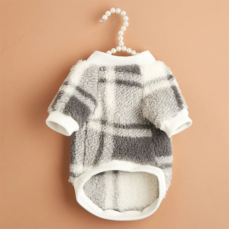 Wrap your small dog in style and comfort with our Cozy Chic Woolen Sweater. Perfect for Chihuahuas, Schnauzers, and puppies, this fleece pullover is a must-have for cooler weather walks. Plaid White 1