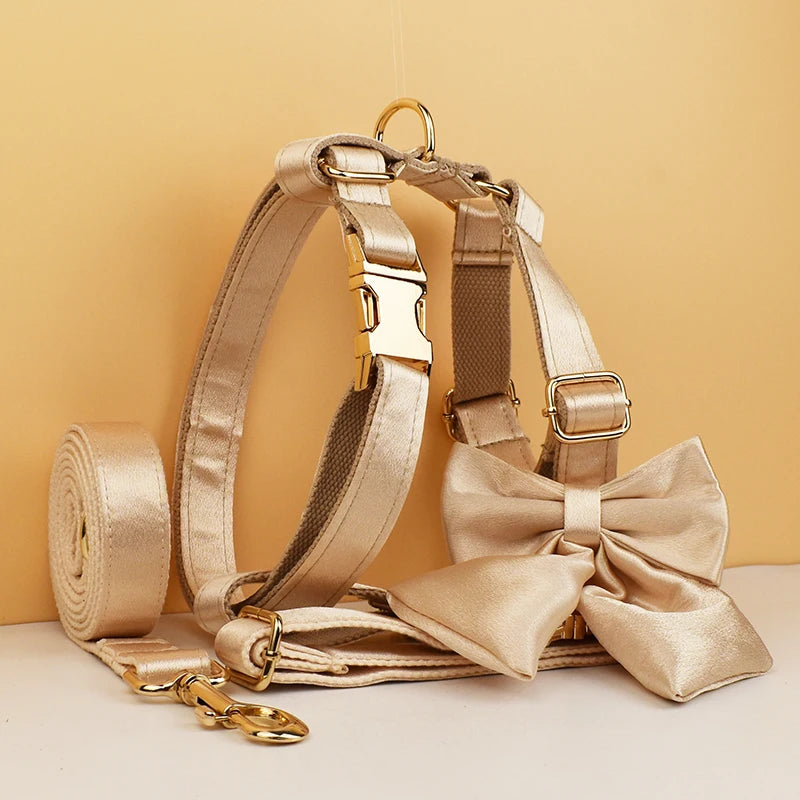 Pamper your pup with the Golden Luxe Silky Dog Set. Personalized bow, collar, leash, and harness in luxurious gold for an elegant, custom look.