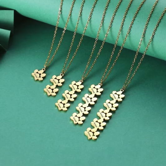 Show your love for your pet with the Personalized Stainless Steel Paw Print Necklace. Custom engraved and elegantly designed for a timeless, lasting keepsake. display of 5 necklaces between 1 and 5 paws