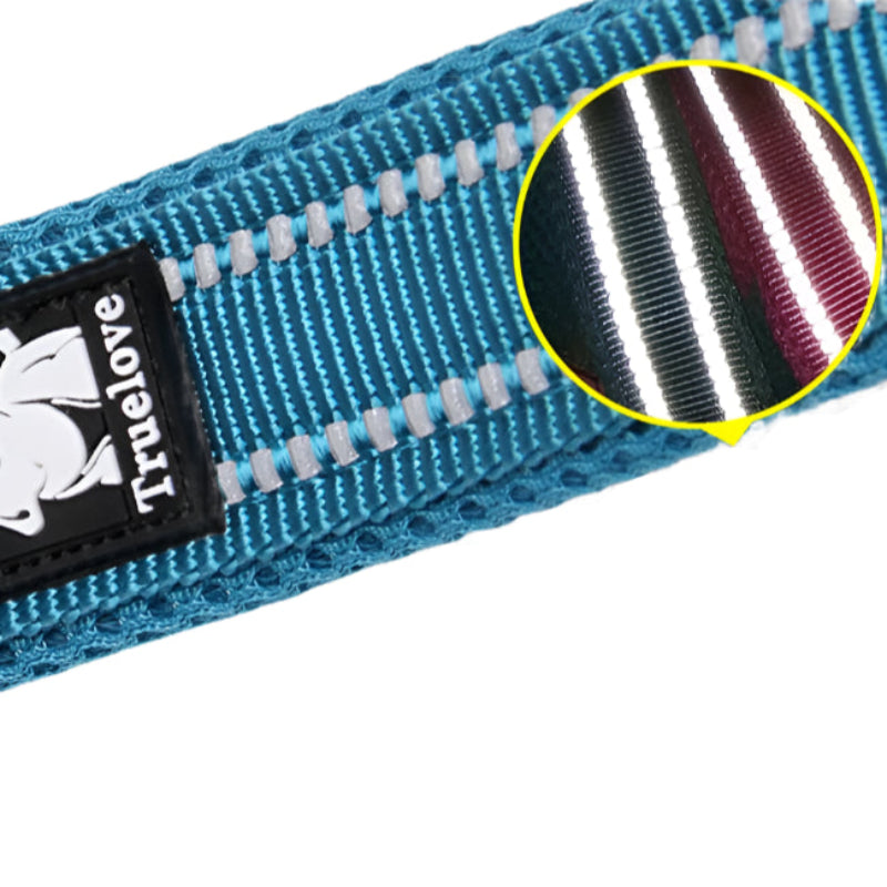 Close-up of a blue dog collar with a TrueLove label and a magnified view of the material texture.