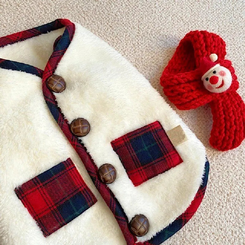dog outfit with plaid details and a red knitted hat on a beige surface